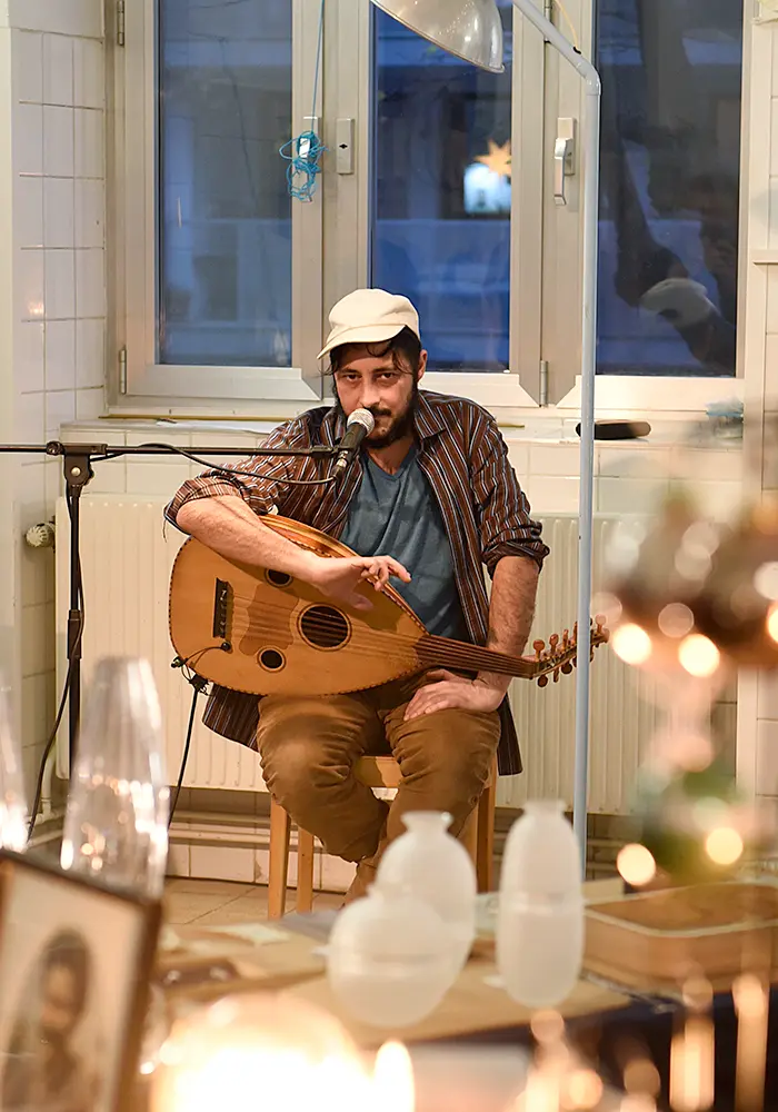 Yoram Rosilio is playing a traditional songs on the zitar